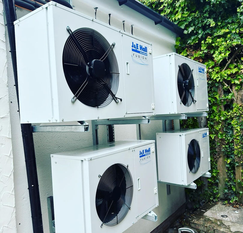 Four air-con units hanging on external wall