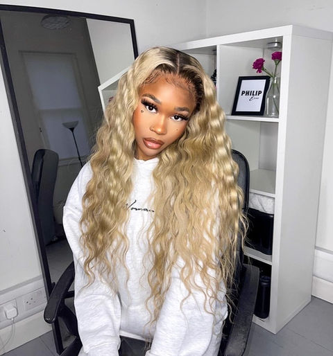 Brown skinned girl called Salma who was in love island in a crimped blonde wig with dark roots