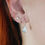 Thumbnail: Small fine silver earring drops with flower pattern