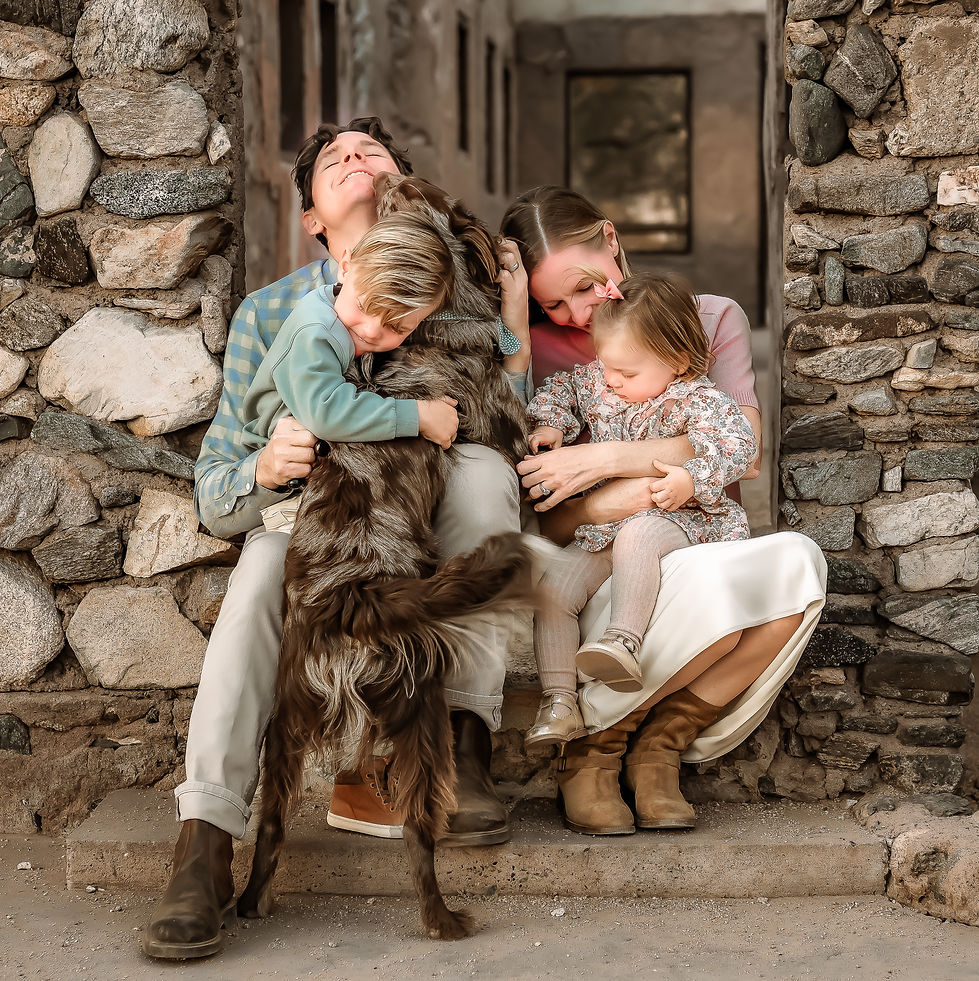Family Photography Session in Buckeye AZ with TAQ Photography loving on their dog and having some fun