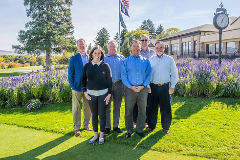 Group of Idaho First Bank employees standing outside posing for a group photo