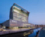 The MUNCH building on the waterfront with a clear sky behind