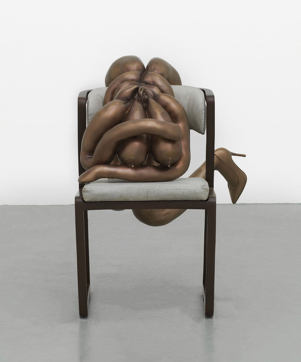 Bronze sculpture of a contorted body on a chair with a white background