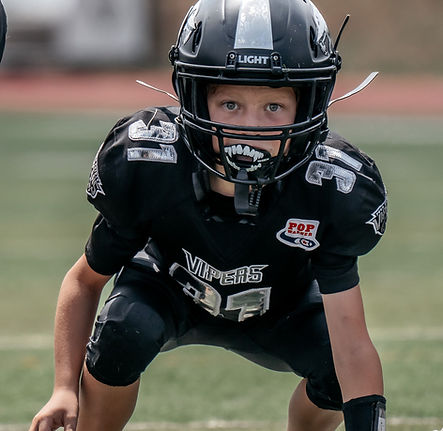 FPPW youth football player ready for a play