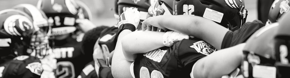 Viper football players with arms on shoulders