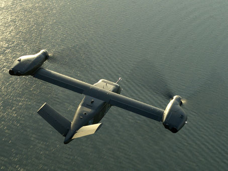 An overhead view of the Bell MV-75 Cheyenne II flying over water.