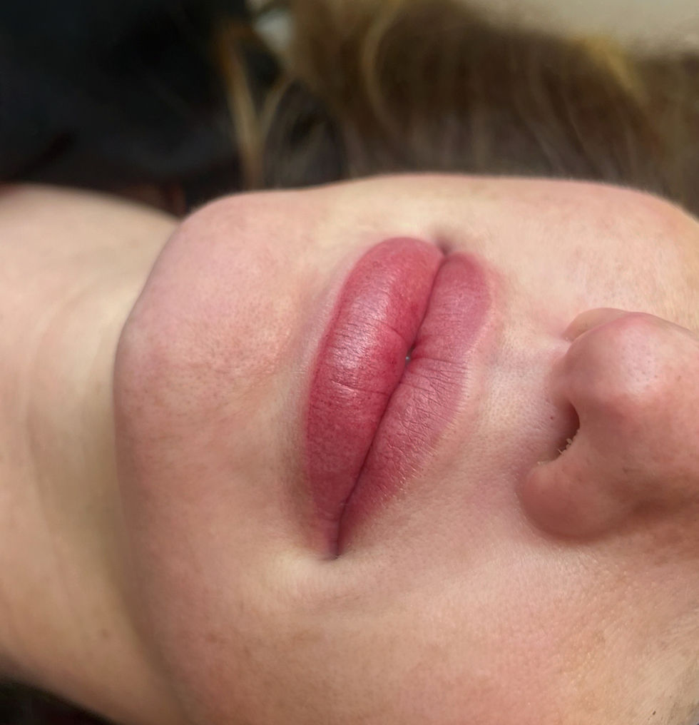 Eye-level view of a tattoo artist preparing pigments for cosmetic tattooing