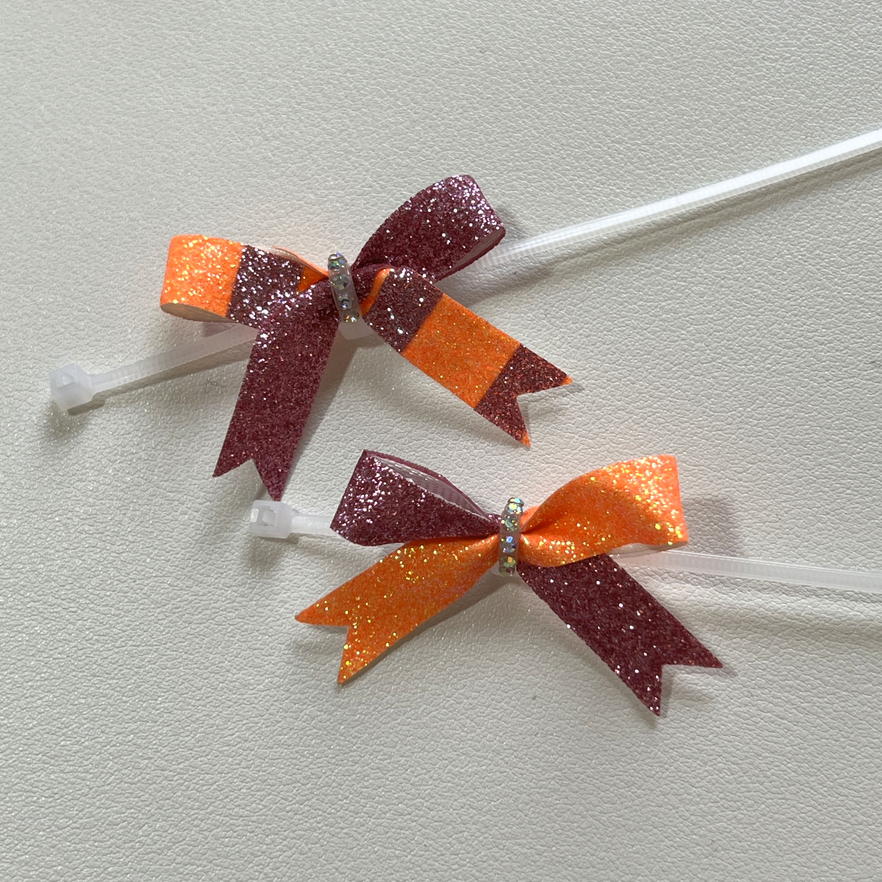 2x Schuhschleifen (rosa-orange, z.T. gestreift)