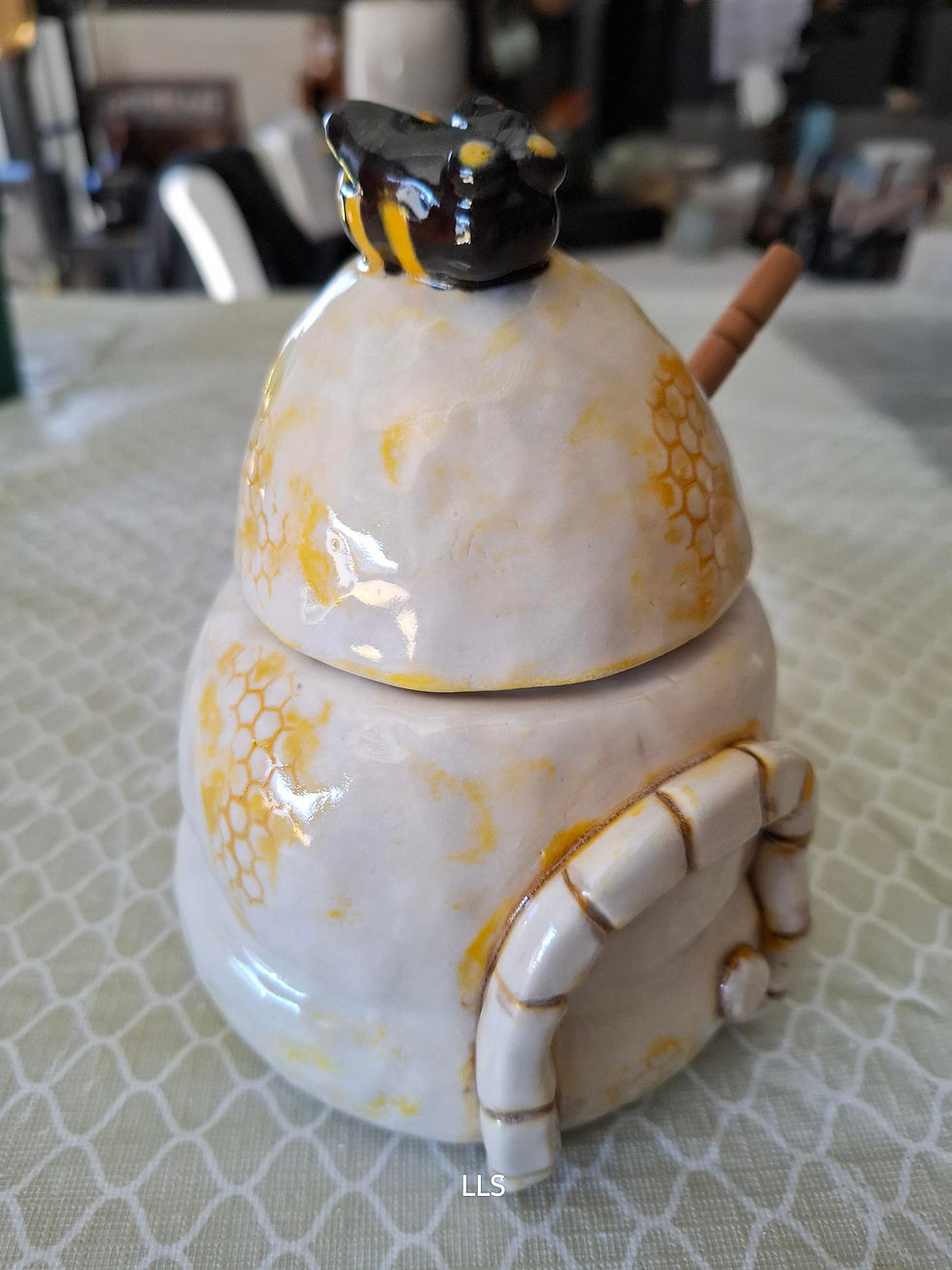 Thumbnail: Glazed ceramic honey pot.