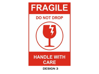 Fragile Handle with Care Do not drop label on a corrugated cardboard box - Stock Image