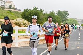Runners competing in a 5k 10k 15k half marathon race at West Creek Park Valencia Santa Clarita California – A Better World Running