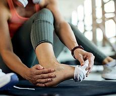 closeup-athletic-woman-injured-her-foot-workout-gym_edited.jpg