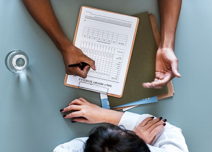 aerial-view-doctor-writing-patient-daily-report-checklist.jpg