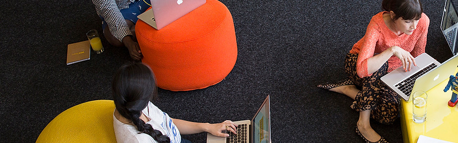 Team reviewing flooring samples on a table
