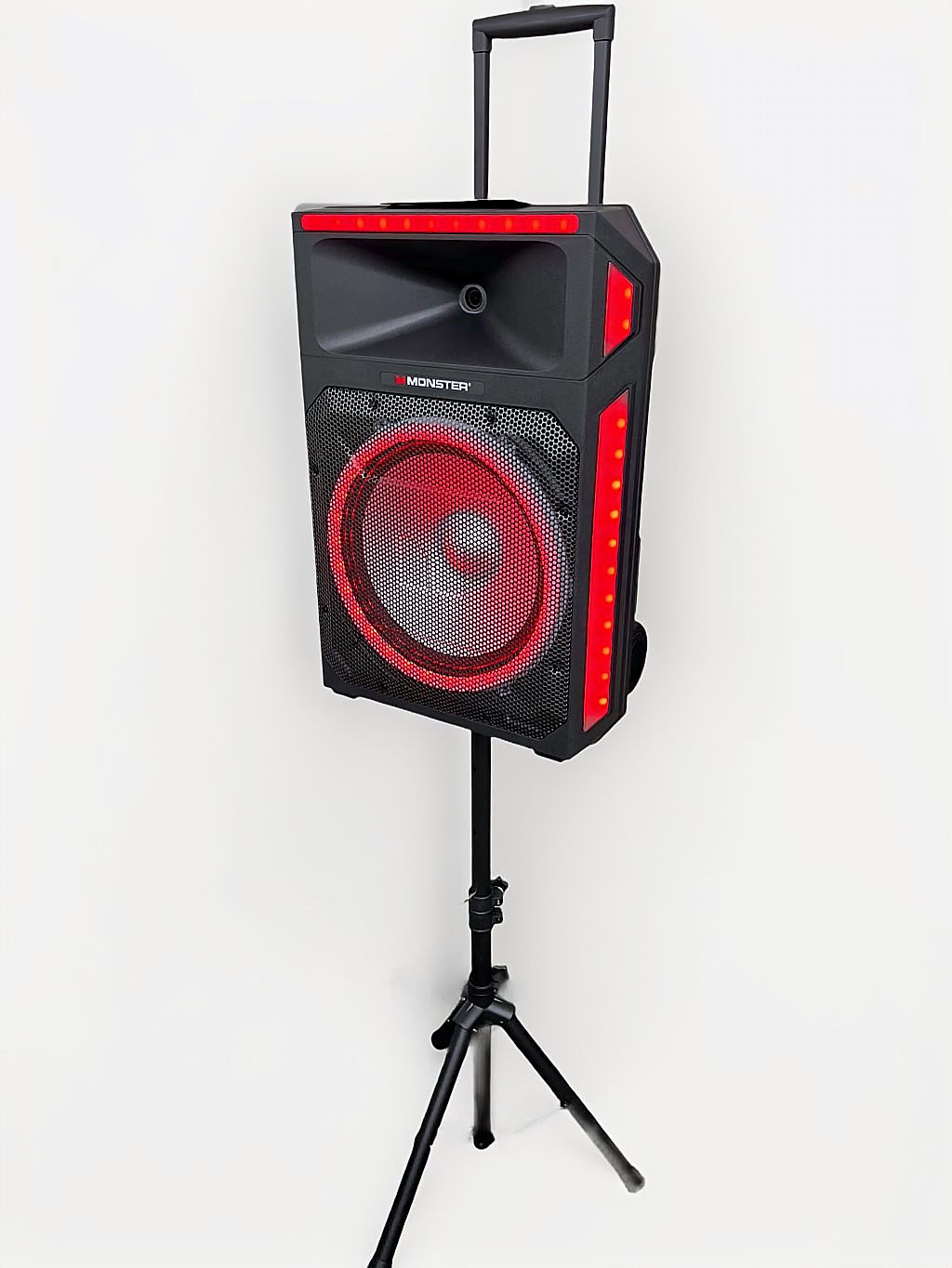 Black speaker with red accents on stand against white background
