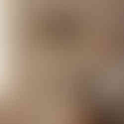“WASH & DRY” engraved wooden shelf above a kneeling man folding laundry next to a wicker basket.