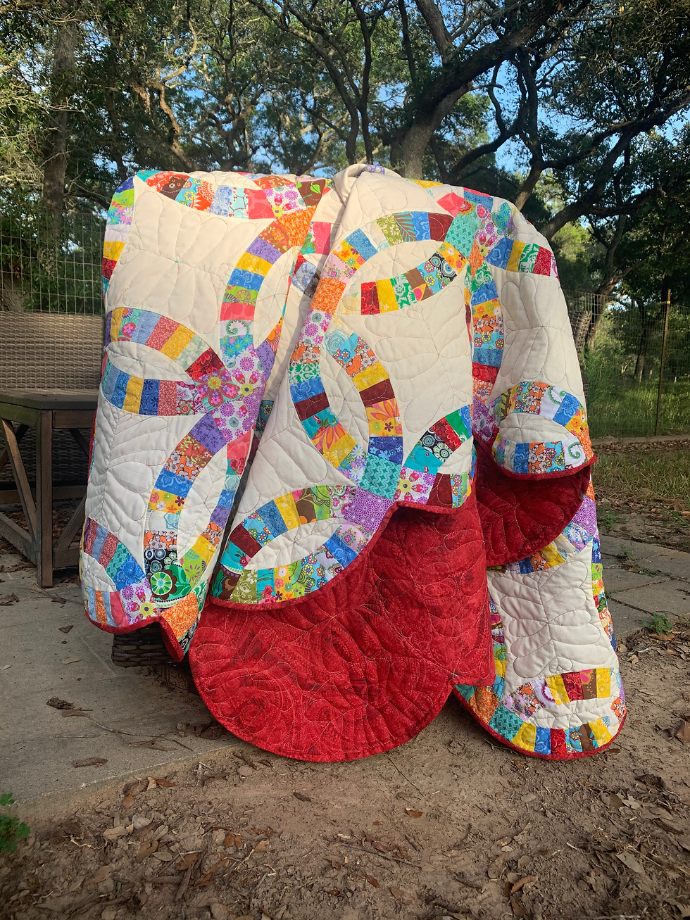 Double Wedding Ring Quilt on a chair.