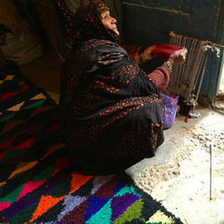 Fatima Haja weaving in Mhamid
