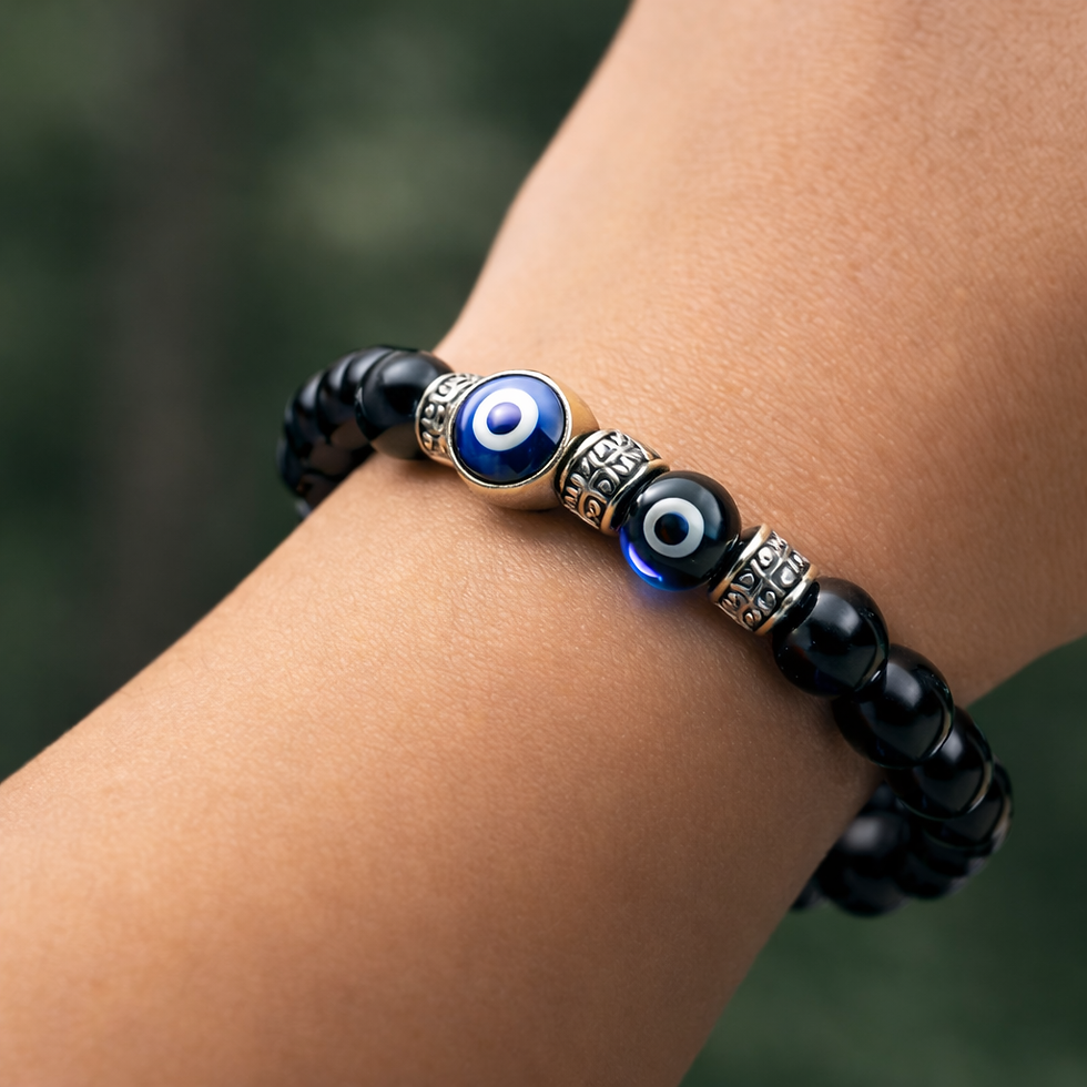 Evil eye bracelet worn on wrist showing black beads and blue eye charm