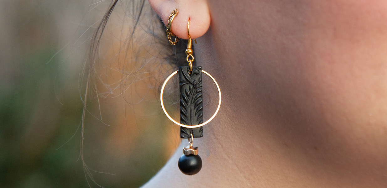 The Don Earrings - Black polymer clay dangles with gold metal details.