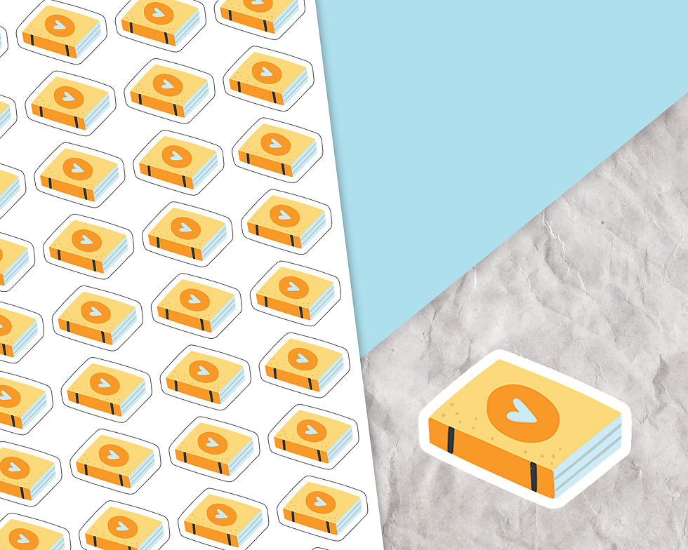 Sticker of a yellow cartoon book with a heart on the cover