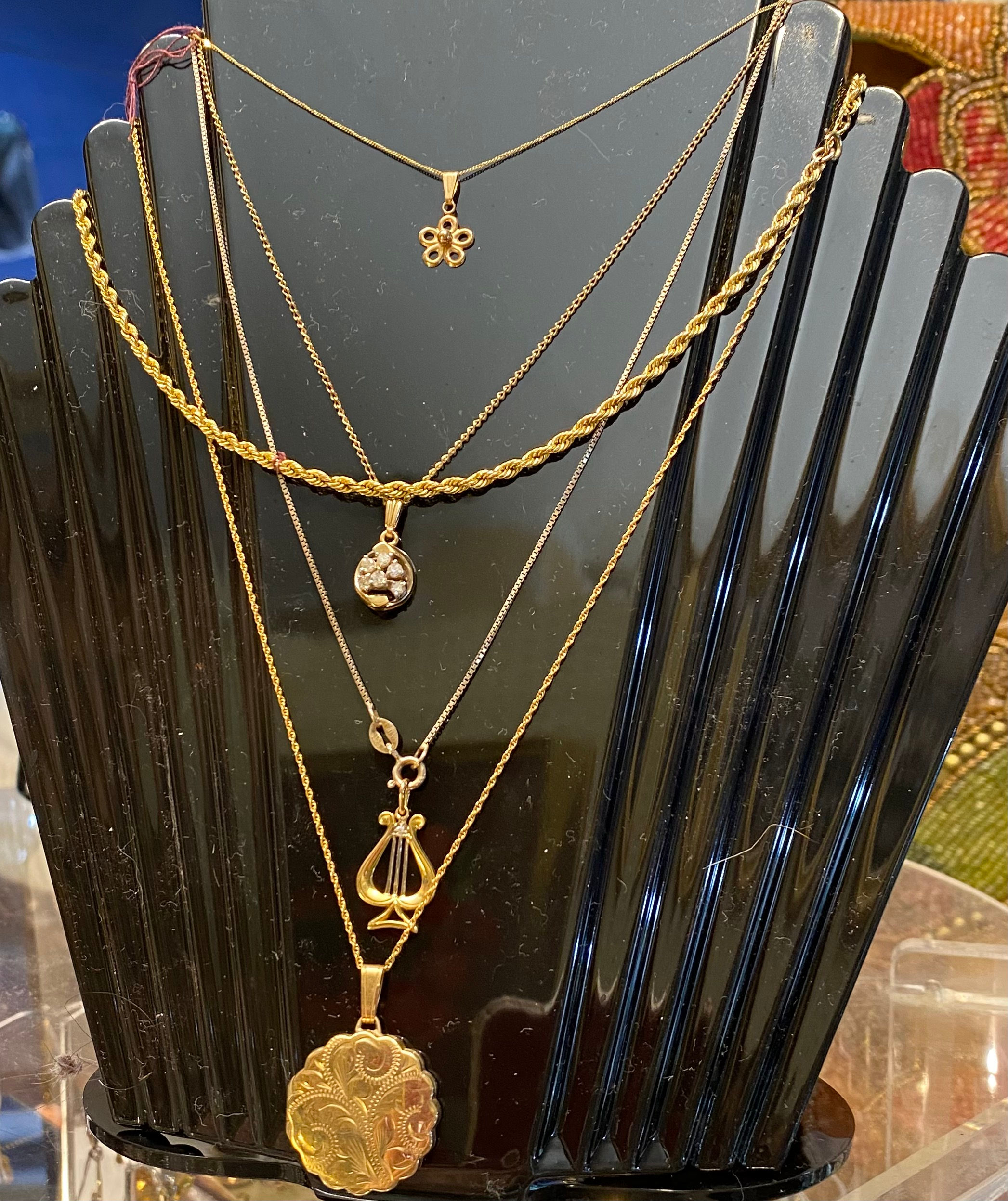 Pendants, all antique and gold including chains.