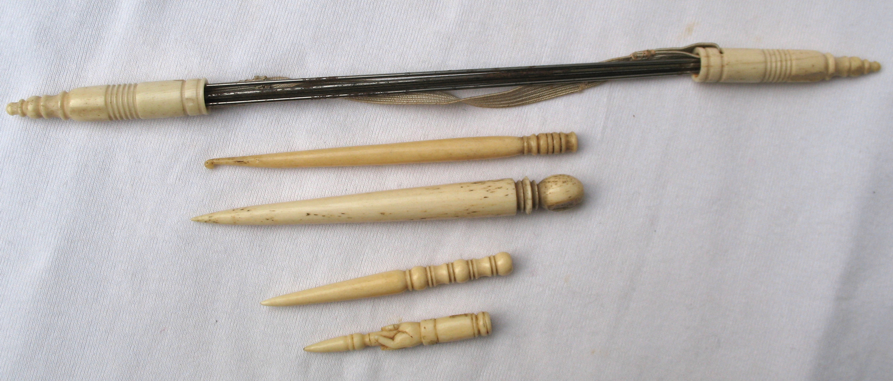 Bone knitting needle end protectors