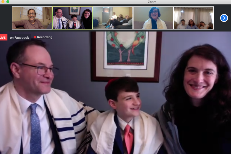 Eli Coustan with his parents, Charles and Hillary, during his Zoom bar mitzvah ceremony. Along the top are friends and family, including the Rabbi (Eli's aunt), Andrea London.