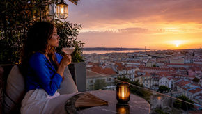 Woman enjoying sunset at Lisbon rooftop bar