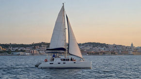 Catamaran sailing on the Tagus near Lisbon at sunset