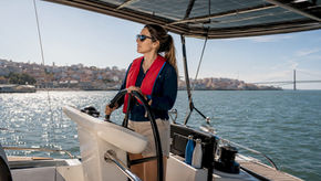 Captain steering sustainable sailing yacht