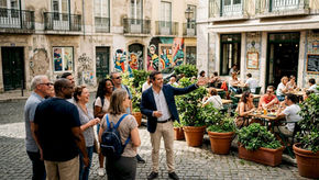 Tour group walking Alfama street with guide