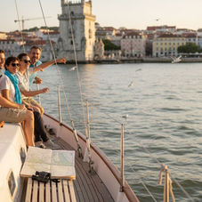 Tourists sailing along Lisbon’s Tagus River