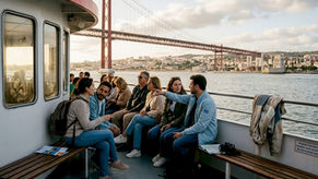 Tourists sightseeing from riverboat on Tagus River