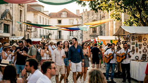 Crowd enjoying festival parade on sunny Lisbon street