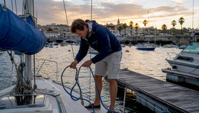Sailor readying boat at Cascais marina
