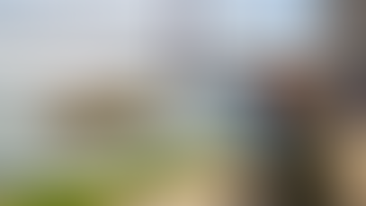 Yellow boat cruising Tagus River in Lisbon