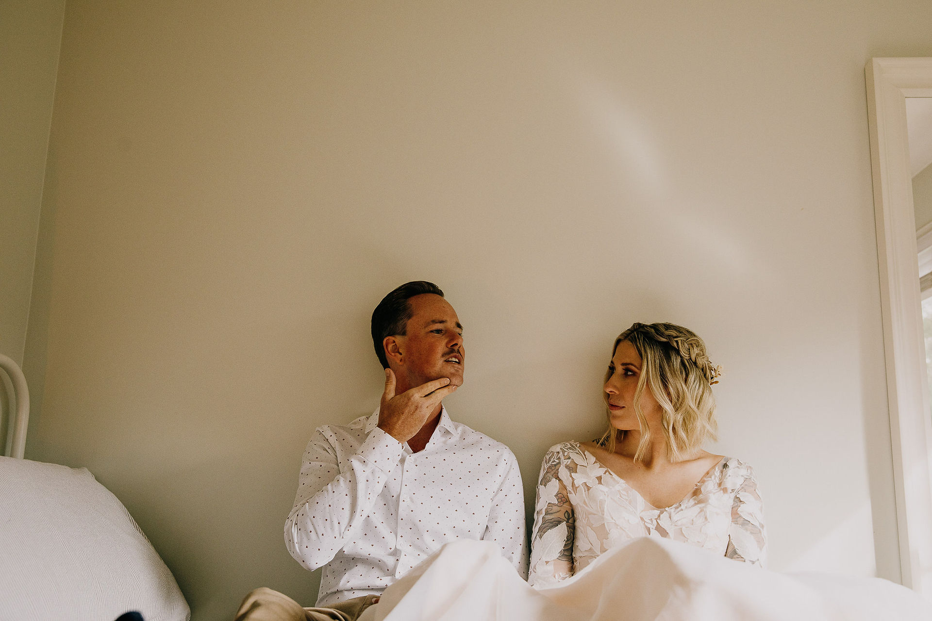 couple getting ready together on their wedding day in toronto by photographger Christine Love Hewitt