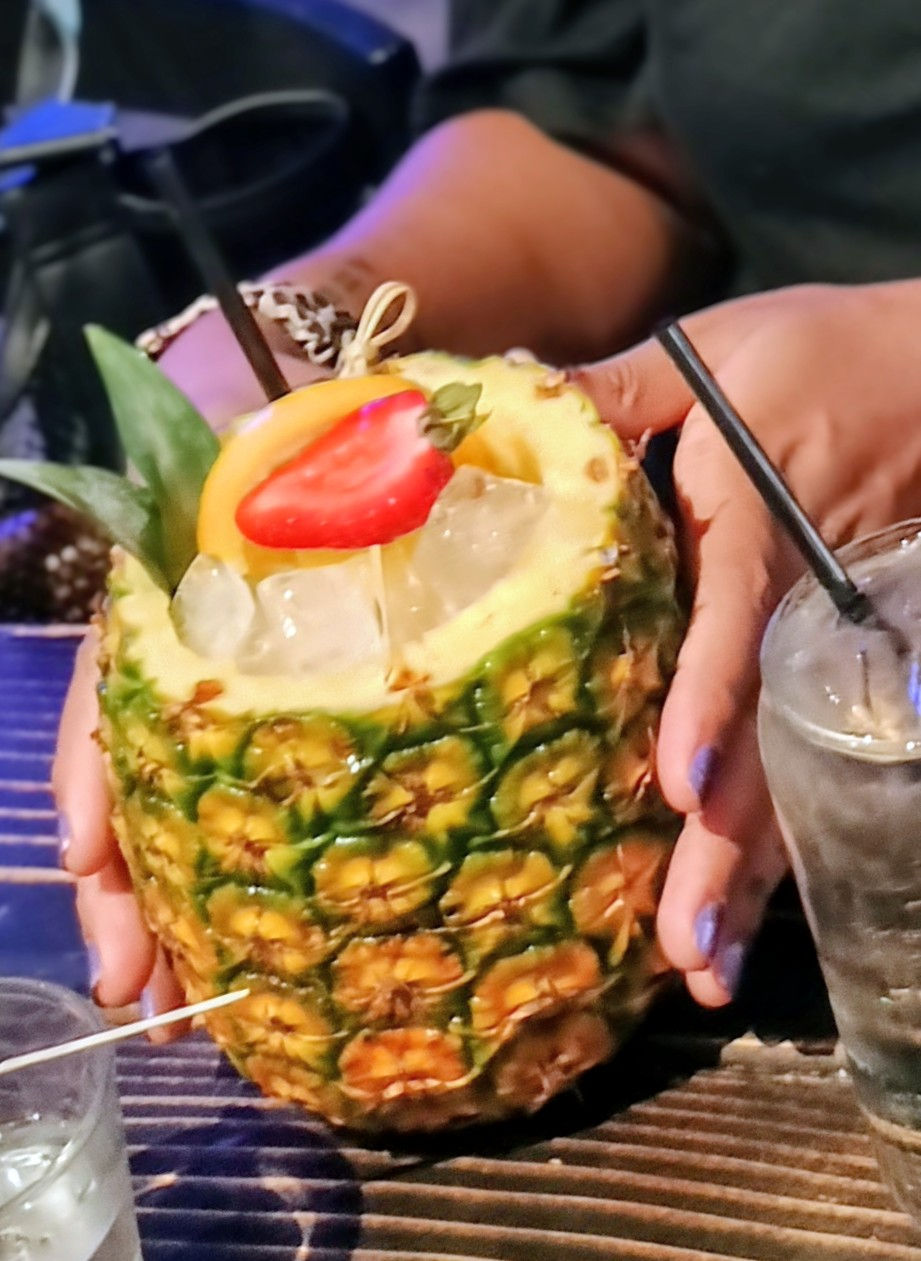 Image of a friend holding a fancy beverage.