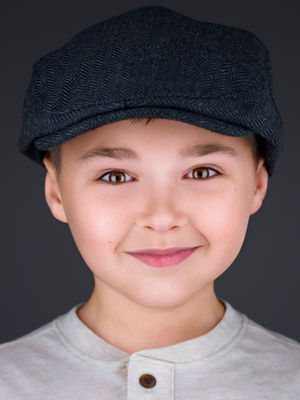 Young actor boy in a hat headshot for auditions and casting calls.  