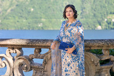 Fashion designer Farah Naz in a blue embroidered gown overlooking Lake Como at Villa del Balbianello.