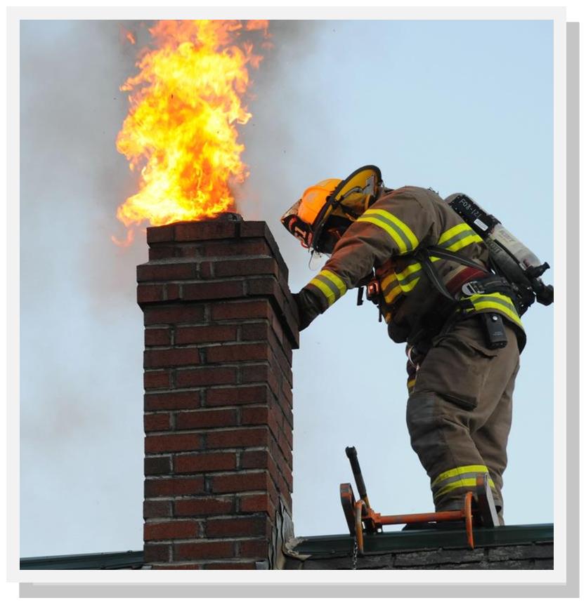 fire fighter on roof - chimney on fire 