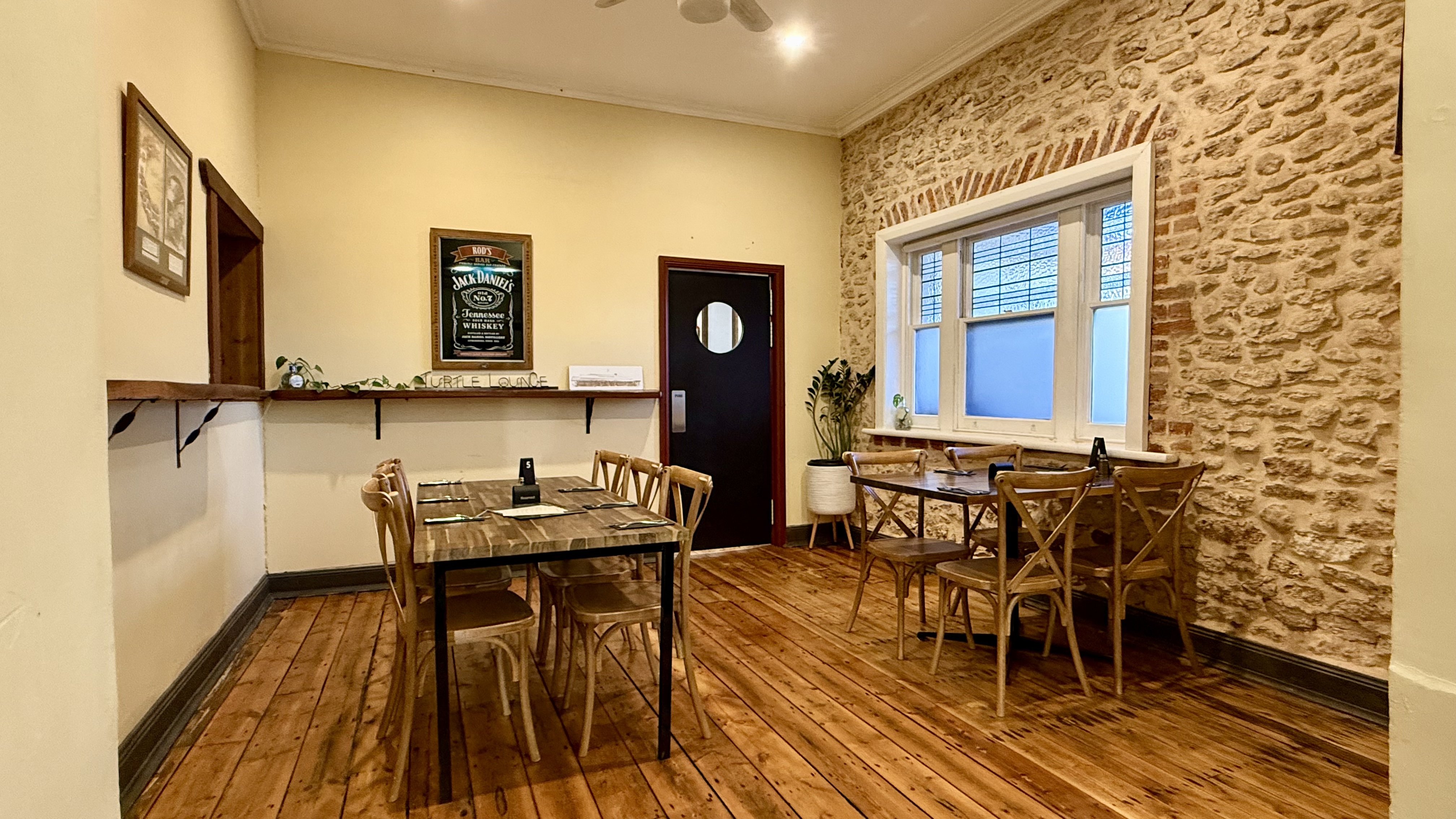 The dining room floorboards and tables in the Gungellan Hotel's bistro room