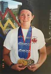 Kristi wearing medals earned at World Police & Fire Games - Spirit's Whisper Ranch