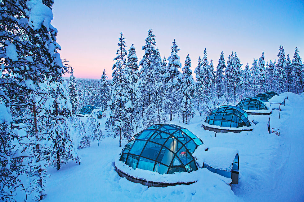 Glass igloos against a snowy backdrop in Saariselka