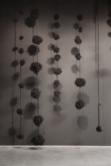 Unidentified Grieving Objects, 2017. Synthetic hair, artist’s hair. wall installation, dimensions variable
