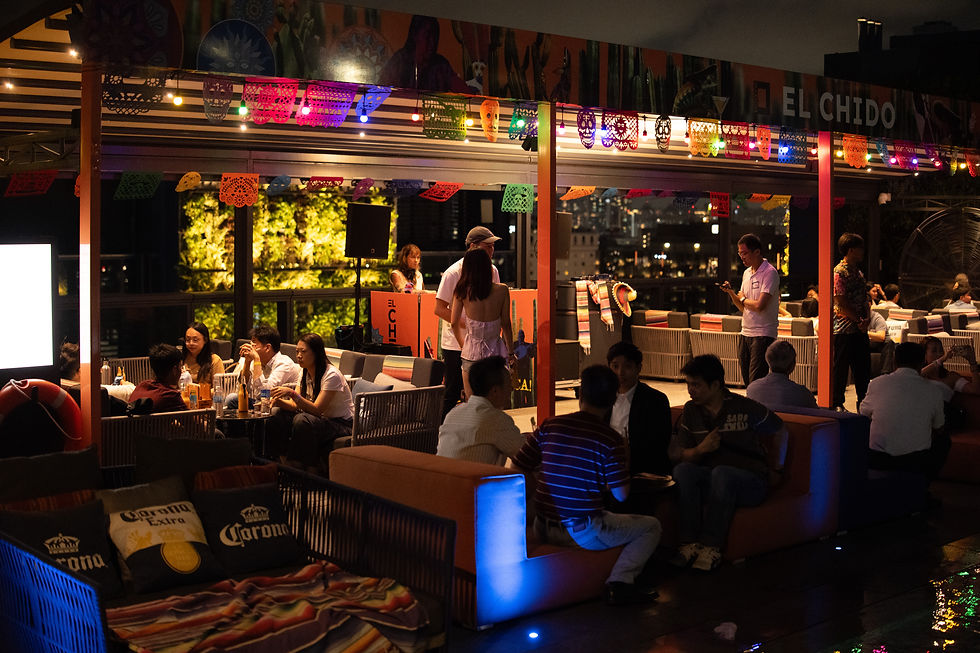 Wide angle view of a vibrant outdoor festival with colorful decorations