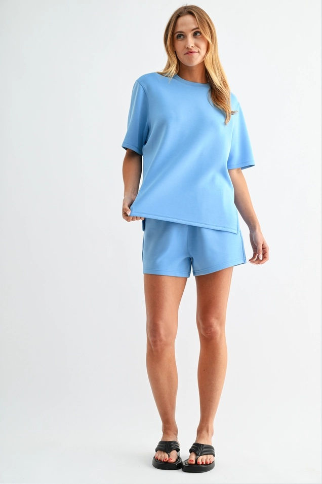 Thumbnail: Light blue women’s scuba tee and shorts set with relaxed fit top and matching shorts, comfy elevated lounge set from La Rose
