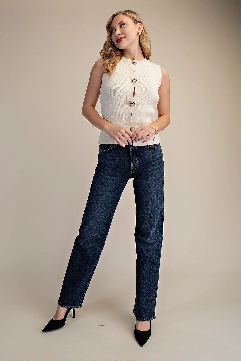 Thumbnail: Cream ribbed sleeveless knit top with decorative gold statement buttons down the front.