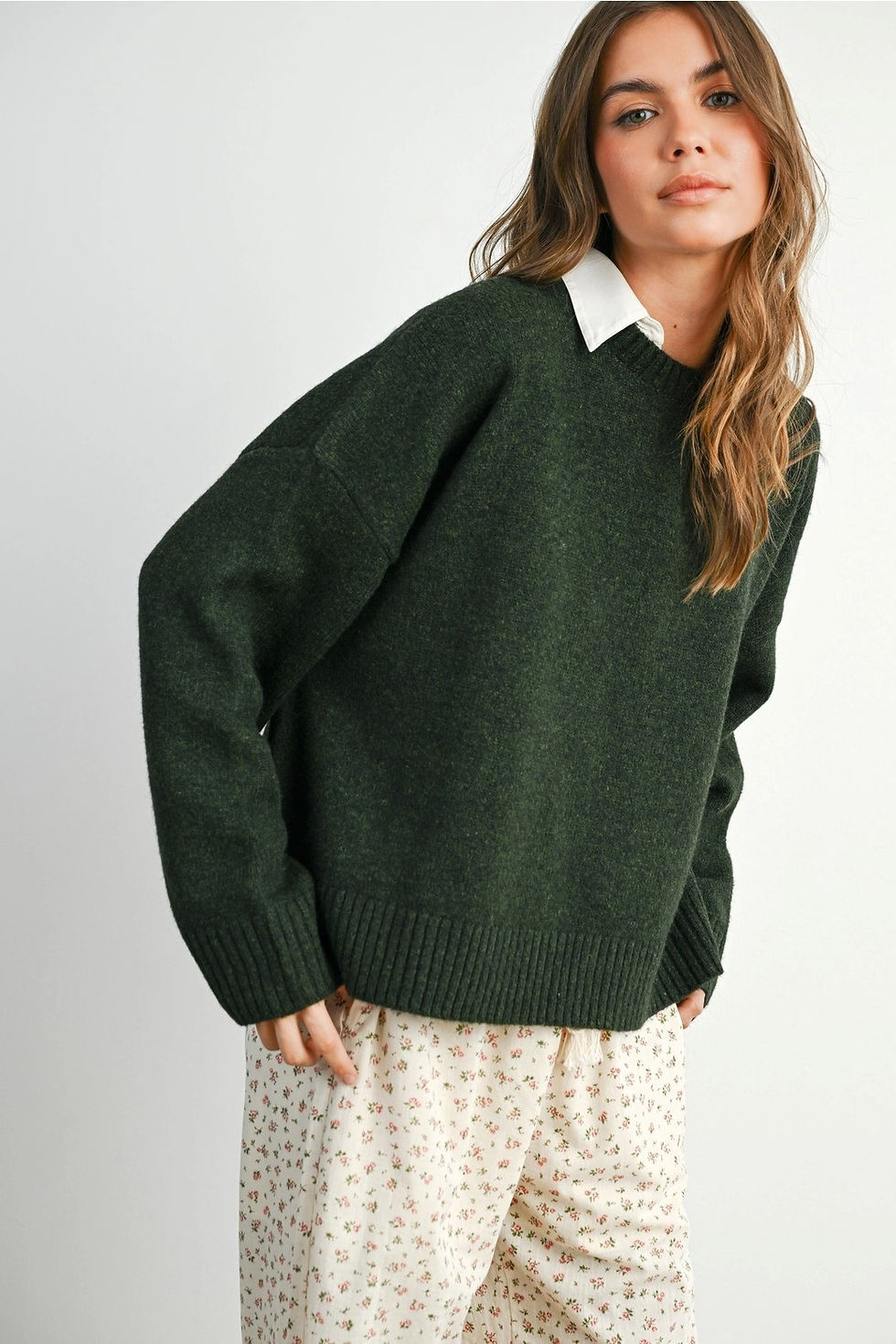 Thumbnail: Dark green knit sweater featuring an open back design with multiple tie closures